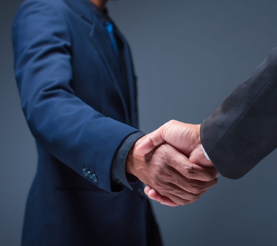 Business people shake hands in the office - Image